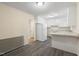 Well-lit kitchen boasts white cabinetry, modern appliances, and durable countertops perfect for cooking and entertaining at 320 Zollicoffer Ave, Henderson, NC 27536