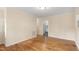 Inviting living room with hardwood floors, ample natural light, and a seamless flow into the adjacent spaces at 320 Zollicoffer Ave, Henderson, NC 27536