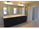 Modern bathroom vanity with double sinks and large mirror at 35 Accord Dr, Youngsville, NC 27596
