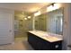 Contemporary bathroom featuring a glass shower and double vanity at 35 Accord Dr, Youngsville, NC 27596