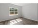 Bright bedroom features a large window offering ample natural light at 35 Accord Dr, Youngsville, NC 27596