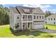 Charming two-story home featuring a covered porch, balcony, and a two-car garage in a desirable neighborhood at 35 Accord Dr, Youngsville, NC 27596