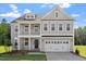 Charming two-story home featuring a covered porch, balcony, and a two-car garage in a desirable neighborhood at 35 Accord Dr, Youngsville, NC 27596