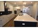Modern kitchen featuring a large center island, stainless steel appliances, and custom cabinetry with sleek hardware at 35 Accord Dr, Youngsville, NC 27596