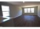 Open-concept living room featuring wood floors and natural light at 35 Accord Dr, Youngsville, NC 27596