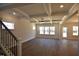 Bright and airy living room with hardwood floors, coffered ceiling, and abundant natural light from large windows at 35 Accord Dr, Youngsville, NC 27596