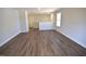 Spacious living room with vinyl floors and neutral color palette at 35 Accord Dr, Youngsville, NC 27596