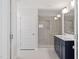 Ensuite bathroom boasts double vanity, walk-in shower, and luxurious finishes at 35 Accord Dr, Youngsville, NC 27596