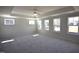 Spacious main bedroom with tray ceiling, fan and many windows at 35 Accord Dr, Youngsville, NC 27596