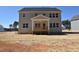 Rear exterior of the house with a covered deck and view of the yard at 35 Accord Dr, Youngsville, NC 27596