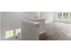 Staircase leading to the second floor with natural light from a window at 35 Accord Dr, Youngsville, NC 27596