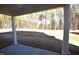 Covered patio overlooking a large backyard with a view of the tree line at 55 Accord Dr, Youngsville, NC 27596