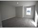 Comfortable carpeted bedroom, providing a relaxing and inviting retreat with plenty of sunlight at 55 Accord Dr, Youngsville, NC 27596