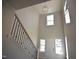 Grand foyer with soaring ceilings and a modern chandelier, offering a bright and inviting space at 55 Accord Dr, Youngsville, NC 27596
