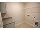Functional laundry room with a granite countertop and essential appliances connections at 55 Accord Dr, Youngsville, NC 27596