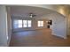 Open concept living room with hardwood floors and an archway leading to the kitchen and dining room at 55 Accord Dr, Youngsville, NC 27596