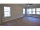 Spacious living room features a ceiling fan, hardwood floors, and large windows allowing for plenty of natural light at 55 Accord Dr, Youngsville, NC 27596