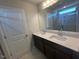 Bathroom featuring a double vanity with stone countertop and a glass-enclosed shower at 55 Calabria Ct, Franklinton, NC 27525