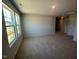 Spacious bedroom with plush carpeting, multiple windows providing ample natural light at 55 Calabria Ct, Franklinton, NC 27525