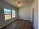 A brightly lit bedroom with 2 windows and hardwood floors at 55 Calabria Ct, Franklinton, NC 27525