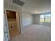 Neutral Bonus Room with view into laundry closet, carpet and 2 double hung windows at 55 Calabria Ct, Franklinton, NC 27525