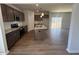 Modern kitchen with granite countertops, an island, and stainless steel appliances at 55 Calabria Ct, Franklinton, NC 27525