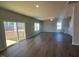 Living room featuring hardwood floors, a sliding glass door, and natural light at 55 Calabria Ct, Franklinton, NC 27525