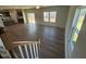 Bright, open living space with hardwood floors and large windows looking out to the backyard at 55 Calabria Ct, Franklinton, NC 27525