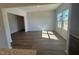Bright living room featuring hardwood floors and large windows for natural light at 55 Calabria Ct, Franklinton, NC 27525