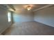 Large main bedroom with neutral carpet, tray ceiling, ceiling fan and bright window views at 55 Calabria Ct, Franklinton, NC 27525