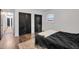 Bedroom featuring a storage closet, window, and wood-look floors at 710 Spring Ln, Sanford, NC 27330