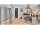 A gourmet kitchen equipped with stainless steel appliances, dark countertops and natural wood flooring at 710 Spring Ln, Sanford, NC 27330