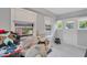 Bright sunroom featuring lots of natural light from windows, neutral paint, and a door to the outside at 710 Spring Ln, Sanford, NC 27330