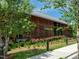 View of the Farmhouse, a community clubhouse with wood and glass exterior at 112 Bear Wallow Forest Way, Wendell, NC 27591