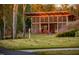 Outdoor lounge area with fireplace and seating at 112 Bear Wallow Forest Way, Wendell, NC 27591