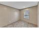 Empty bedroom featuring neutral walls, plush carpet, and a window with natural light at 1235 Schloss Rd, Louisburg, NC 27549