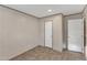 Empty bedroom featuring neutral walls, plush carpet, and two doors for access at 1235 Schloss Rd, Louisburg, NC 27549