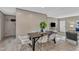 The dining room features a dining table with seating, contemporary decor, and neutral tones at 1235 Schloss Rd, Louisburg, NC 27549