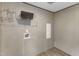 Laundry room featuring wire shelving, tile floors, and washer hookups for convenience at 1235 Schloss Rd, Louisburg, NC 27549
