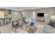 Cozy living room with gray cabinets, comfortable seating, stylish decor, and an open layout at 1235 Schloss Rd, Louisburg, NC 27549