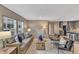 Bright and airy living area with large windows, comfortable seating, and stylish decor with access to other rooms at 1235 Schloss Rd, Louisburg, NC 27549