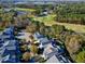 Expansive aerial view showcasing the roof and golf course of this well-maintained grey-toned residential home at 1509 Heritage Reserve Ct, Wake Forest, NC 27587