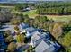 Expansive aerial view showcasing the roof and golf course of this well-maintained grey-toned residential home at 1509 Heritage Reserve Ct, Wake Forest, NC 27587