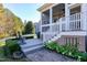 Covered back porch area with stairs down to the yard, ideal for entertaining at 1509 Heritage Reserve Ct, Wake Forest, NC 27587