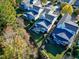 Overhead shot of backyard with manicured lawn, tasteful landscaping, and a charming screened-in porch and white picket fence at 1509 Heritage Reserve Ct, Wake Forest, NC 27587
