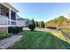 Landscaped backyard featuring well-kept lawn and decorative trees and hedges at 1509 Heritage Reserve Ct, Wake Forest, NC 27587