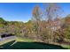 Large backyard with a view of mature trees and a fence at 1509 Heritage Reserve Ct, Wake Forest, NC 27587