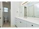 This bathroom has a white vanity, mirror and tiled shower at 1509 Heritage Reserve Ct, Wake Forest, NC 27587