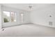 Sunny bedroom with neutral carpet, ceiling fan, and access to the outdoors at 1509 Heritage Reserve Ct, Wake Forest, NC 27587