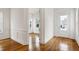 Entryway featuring white trim and natural hardwood flooring at 1509 Heritage Reserve Ct, Wake Forest, NC 27587
